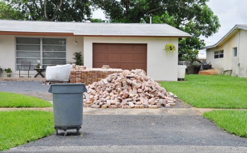 Commercial waste removal trucks in Cobham